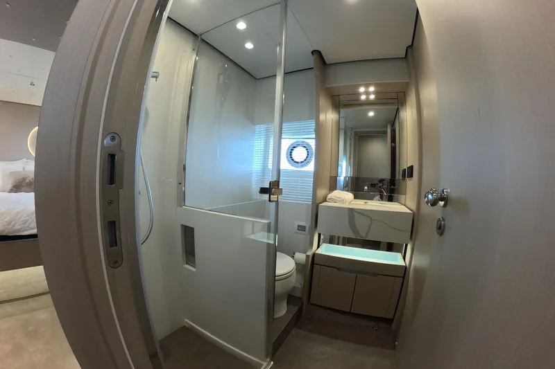 Slide: The Image of Luxurious bathroom interior of 2023 Azimut Fly 68 yacht, featuring modern fixtures and elegant design. - 100