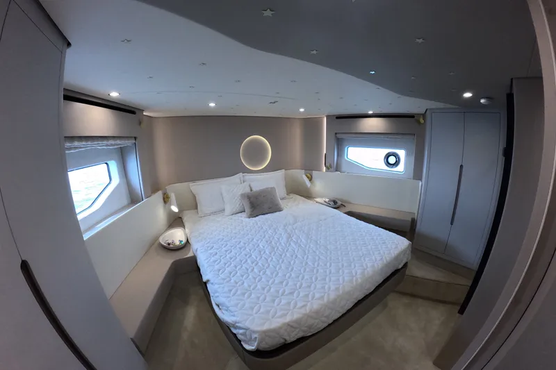 Slide: The Image of Luxurious bedroom interior of 2023 Azimut Fly 68 yacht with modern design and ambient lighting. - 107
