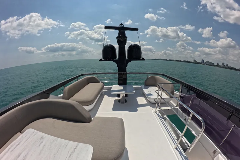 Slide: The Image of Luxurious 2023 Azimut Fly 68 yacht deck with ocean view and elegant seating. - 38