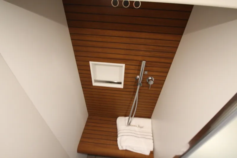 Slide: The Image of Luxurious shower area in 2023 Azimut Fly 68 yacht with wooden accents. - 91