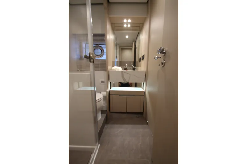 Slide: The Image of Luxurious bathroom interior of 2023 Azimut Fly 68 yacht, featuring modern fixtures and elegant design. - 99