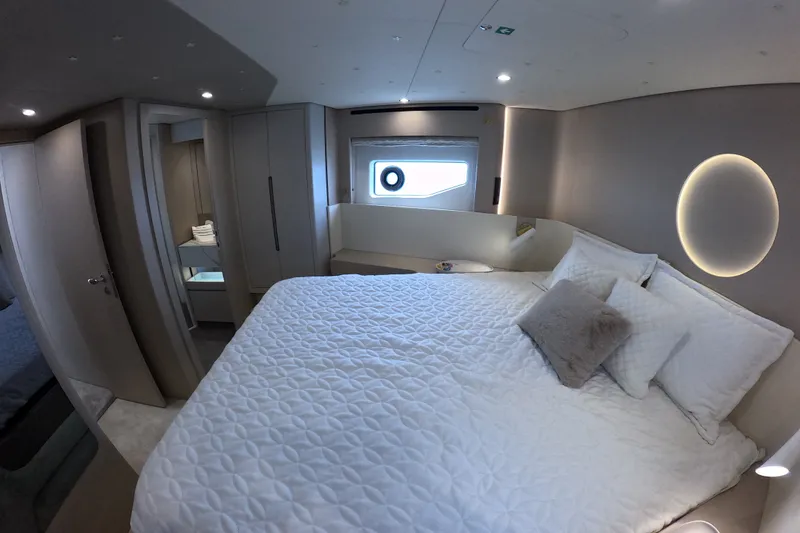 Slide: The Image of Luxurious bedroom interior of 2023 Azimut Fly 68 yacht with modern design and cozy bedding. - 108