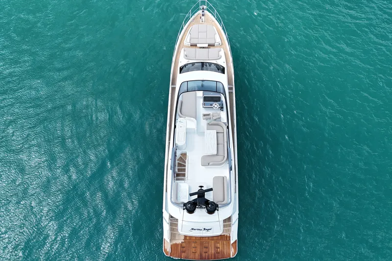 Slide: The Image of Aerial view of 2023 Azimut Fly 68 yacht on turquoise water. - 9