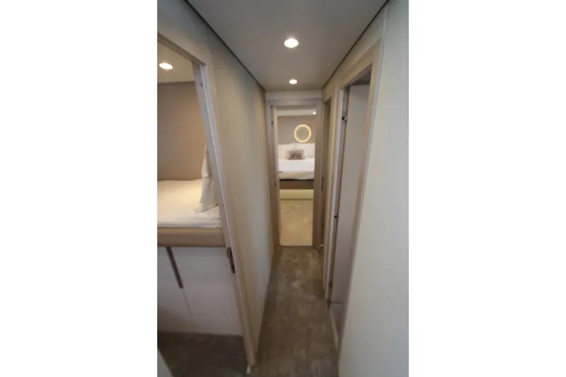 Slide: The Image of Hallway inside 2023 Azimut Fly 68 yacht, featuring modern interior design and cozy bedrooms. - 93