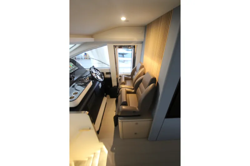Slide: The Image of Interior of 2023 Azimut Fly 68 yacht with modern helm and seating. - 62