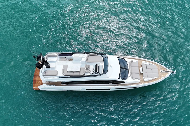 Slide: The Image of Aerial view of 2023 Azimut Fly 68 yacht on turquoise water. - 2