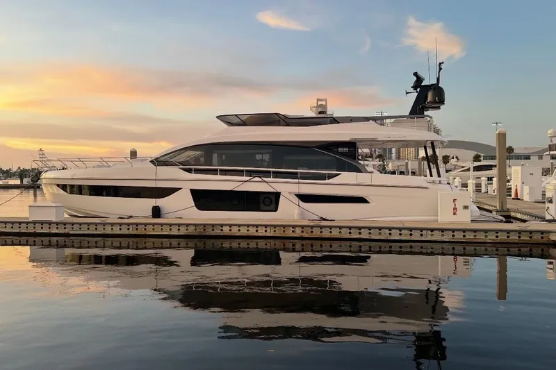 Slide: The Image of Luxury Azimut Fly 68 yacht docked at sunset, 2023 model, reflecting on calm water. - 124
