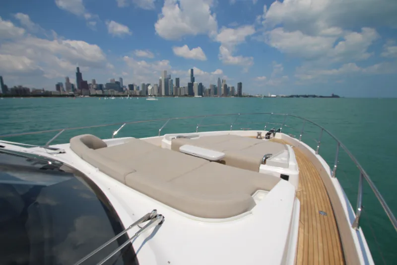 Slide: The Image of Azimut Fly 68 yacht cruising with city skyline in the background, 2023 model. - 29
