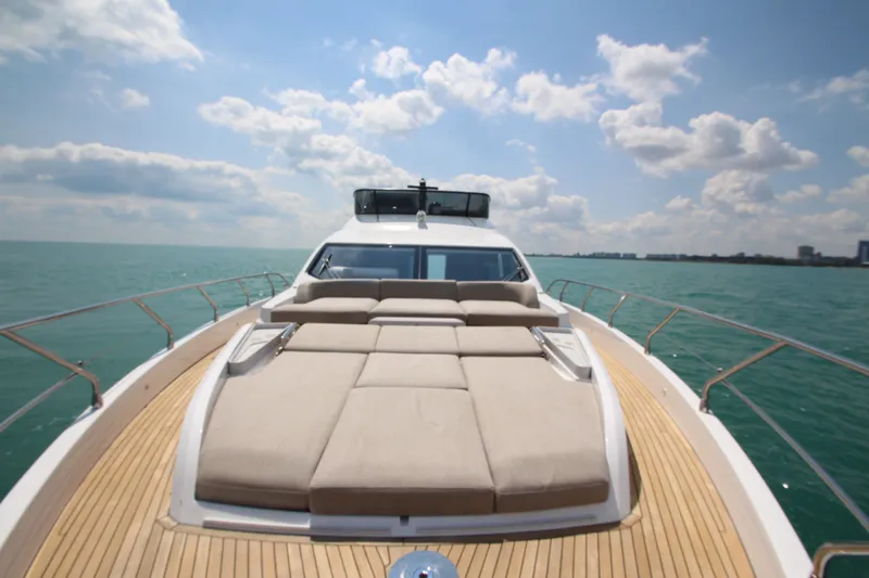 Slide: The Image of Luxurious 2023 Azimut Fly 68 yacht with spacious sun deck on open sea. - 28