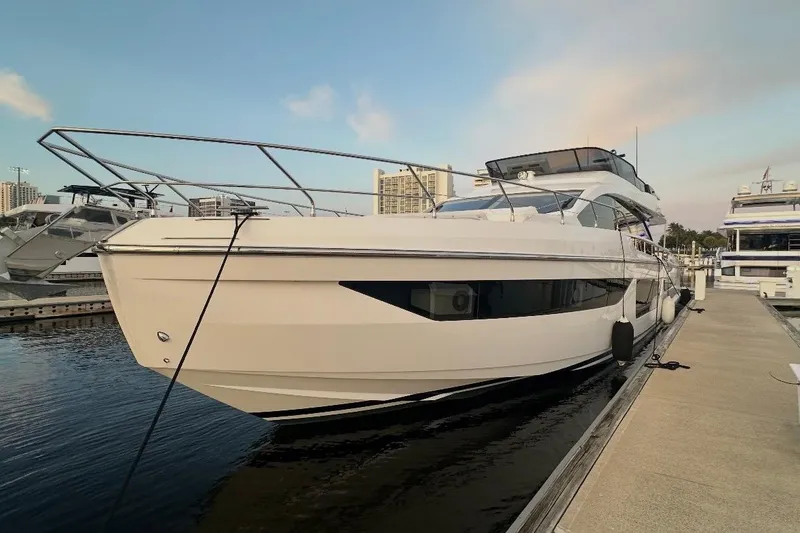 Slide: The Image of 2023 Azimut Fly 68 yacht docked at marina under clear sky. - 122