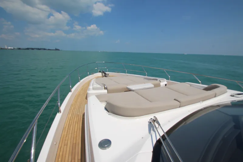 Slide: The Image of Luxurious 2023 Azimut Fly 68 yacht deck with sun loungers on open sea. - 25