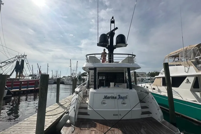 Slide: The Image of 2023 Azimut Fly 68 yacht docked at marina under cloudy sky. - 119