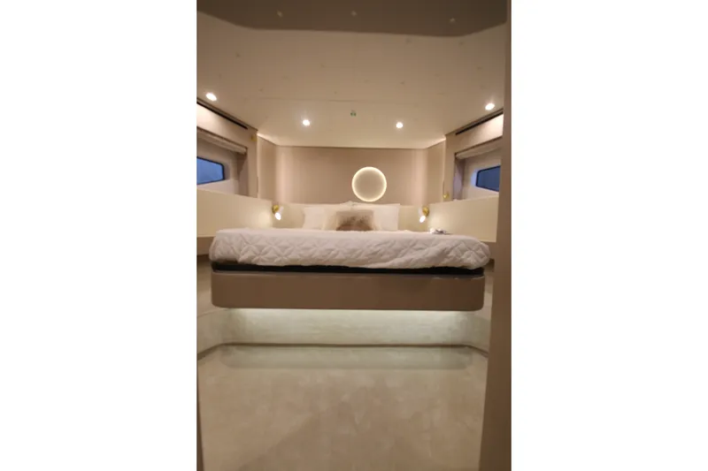 Slide: The Image of Luxurious bedroom interior of 2023 Azimut Fly 68 yacht, featuring modern design and ambient lighting. - 104