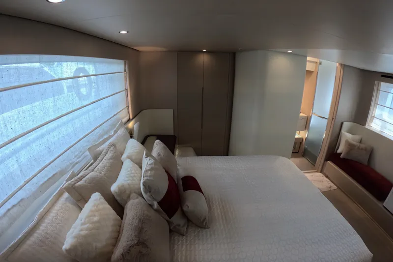 Slide: The Image of Luxurious bedroom interior of 2023 Azimut Fly 68 yacht, featuring elegant bedding and modern design. - 81