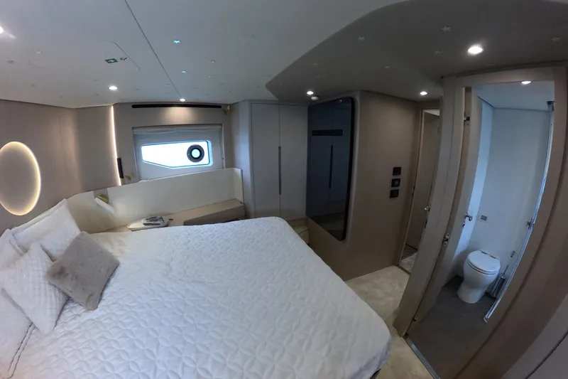 Slide: The Image of Luxurious bedroom interior of 2023 Azimut Fly 68 yacht, featuring modern design and ensuite bathroom. - 110