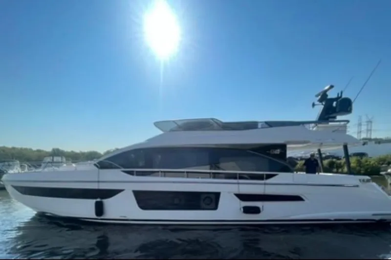 Slide: The Image of 2023 Azimut Fly 68 yacht on water under clear blue sky. - 117