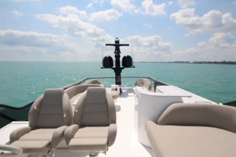 Slide: The Image of Luxurious 2023 Azimut Fly 68 yacht deck with plush seating, overlooking serene ocean waters. - 39