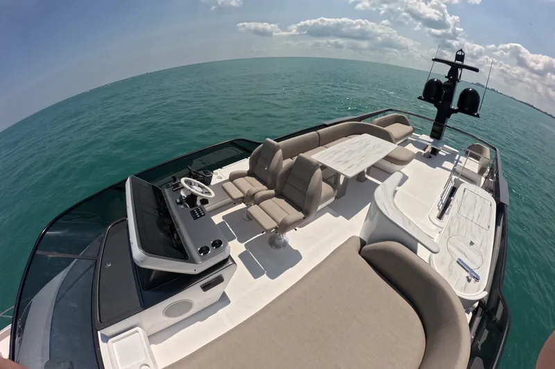Slide: The Image of Luxurious 2023 Azimut Fly 68 yacht deck with elegant seating and ocean view. - 37