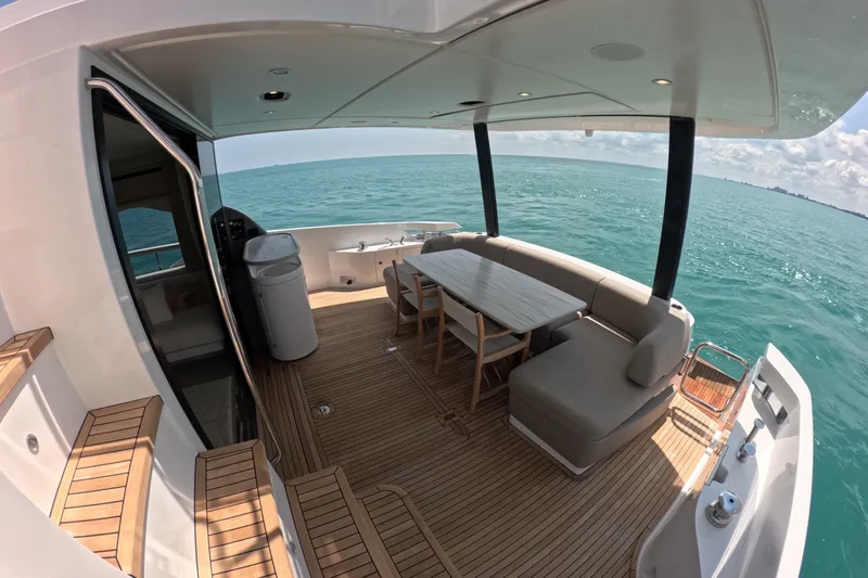 Slide: The Image of Luxurious 2023 Azimut Fly 68 yacht deck with elegant seating and ocean view. - 19