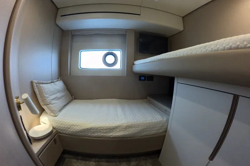 Slide: The Image of Luxurious cabin interior of 2023 Azimut Fly 68 yacht with cozy bedding and modern design. - 94