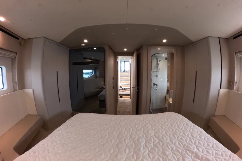 Slide: The Image of Luxurious interior of 2023 Azimut Fly 68 yacht, featuring a modern bedroom and ensuite bathroom. - 111