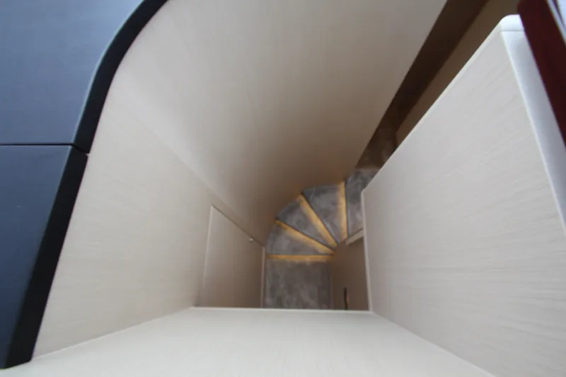 Slide: The Image of Staircase inside 2023 Azimut Fly 68 yacht, featuring modern design and lighting. - 70