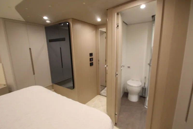 Slide: The Image of Luxurious interior of 2023 Azimut Fly 68 yacht featuring modern bathroom and bedroom. - 112