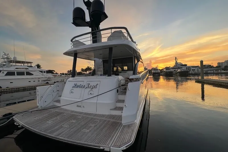 Slide: The Image of 2023 Azimut Fly 68 yacht docked at sunset in a marina. - 121