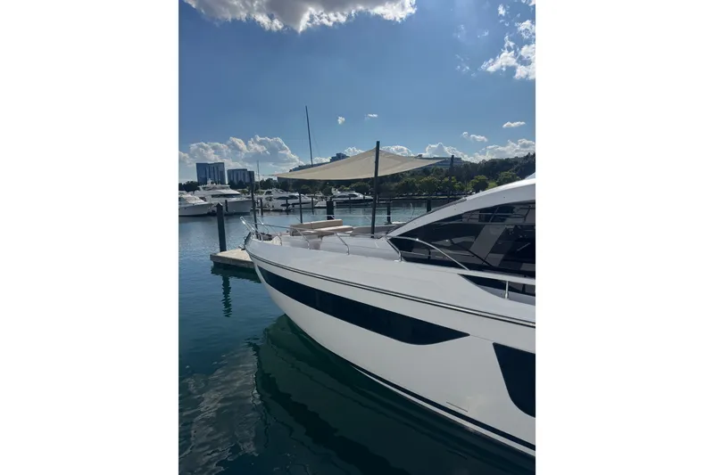 Slide: The Image of 2023 Azimut Fly 68 yacht docked in a sunny marina. - 178