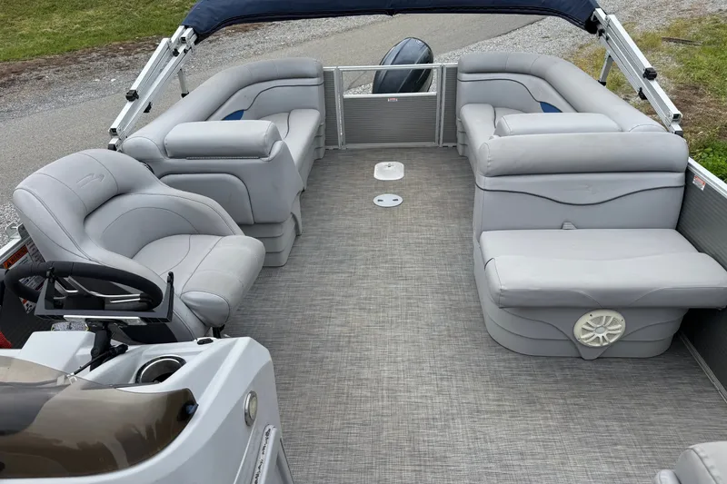 Slide: The Image of 2020 Bennington S 22 SL pontoon boat interior with plush seating and steering console. - 13