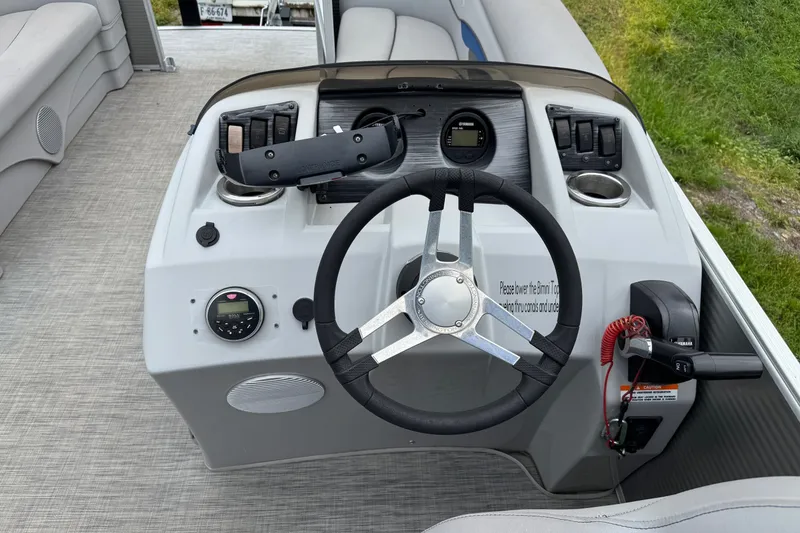 Slide: The Image of 2020 Bennington S 22 SL boat dashboard with steering wheel and controls. - 15