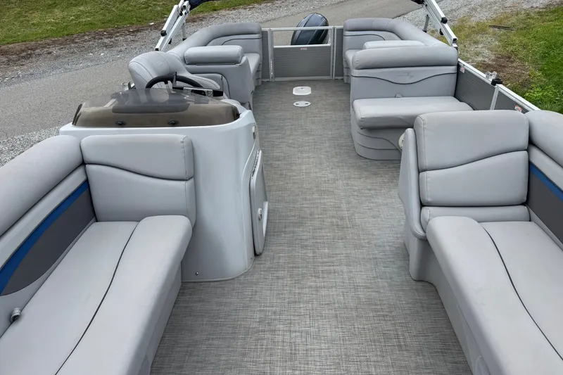 Slide: The Image of 2020 Bennington S 22 SL pontoon boat interior with gray seating and helm. - 6