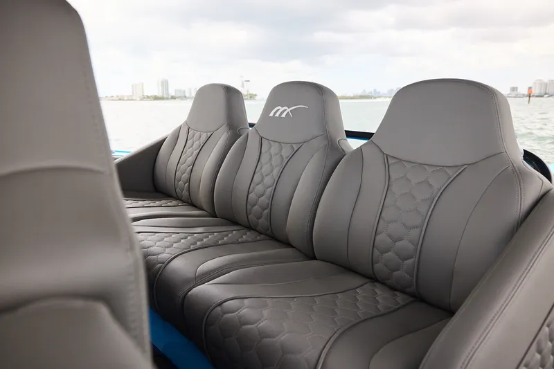 Slide: The Image of Luxurious seating on a Midnight Express 43 Open boat with gray leather upholstery. - 16