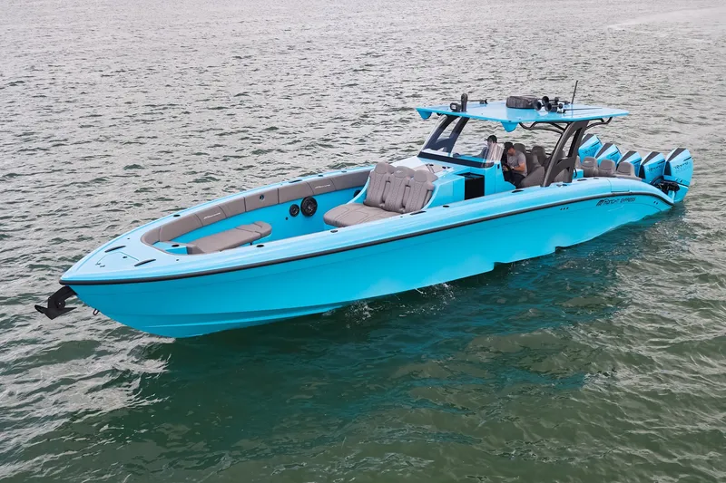 Slide: The Image of Bright blue Midnight Express 43 Open boat cruising on calm waters. - 6