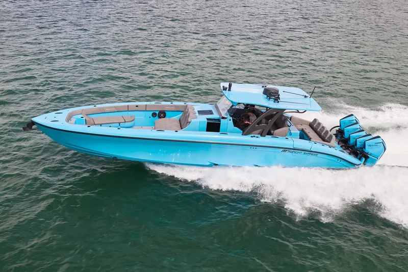 The Image of Blue Midnight Express 43 Open boat cruising on the water with multiple outboard engines. - 0