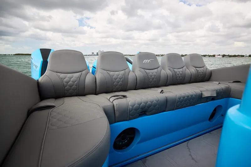Slide: The Image of Luxurious seating on Midnight Express 43 Open boat with stylish gray upholstery and blue accents. - 20