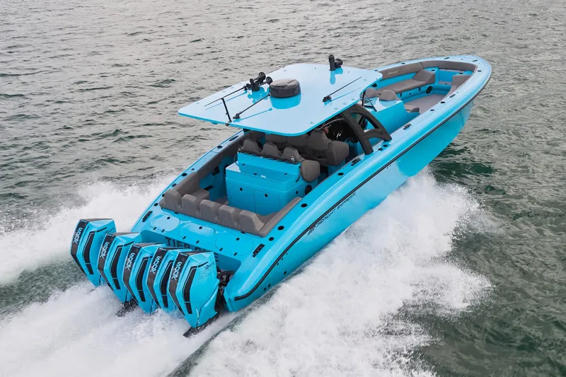Slide: The Image of Bright blue Midnight Express 43 Open boat with multiple outboard engines cruising on water. - 4