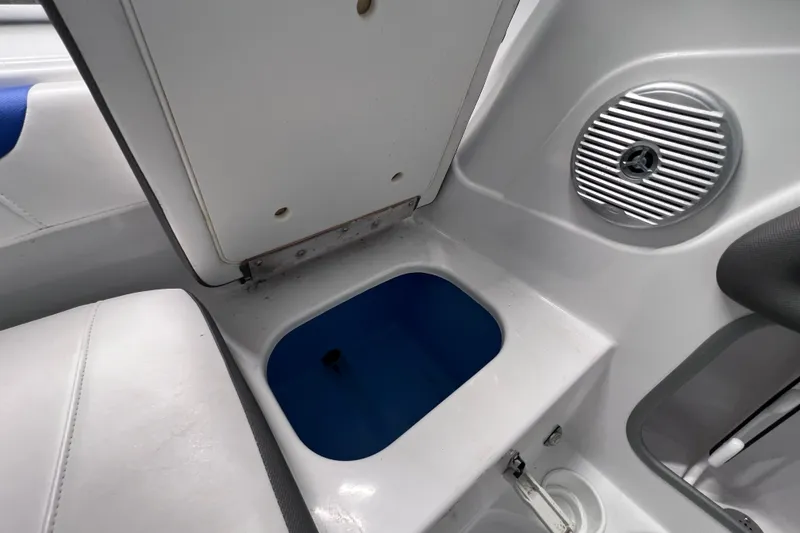 Slide: The Image of 2024 Tahoe 200 S boat interior with storage compartment and speaker detail. - 34