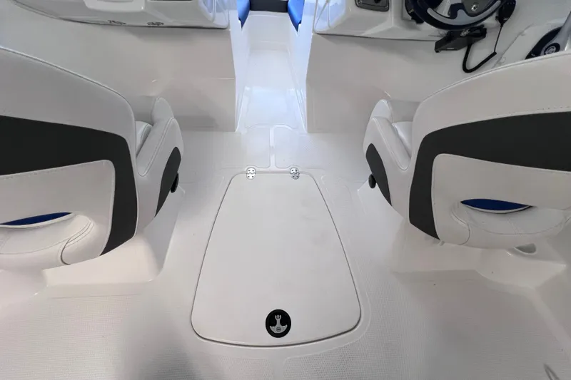 Slide: The Image of Interior of 2024 Tahoe 200 S boat with white seating and steering wheel. - 33