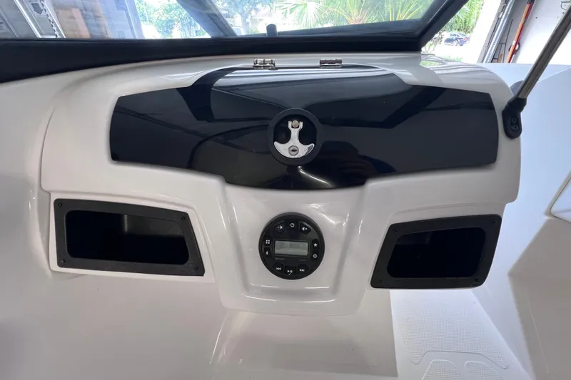 Slide: The Image of 2024 Tahoe 200 S dashboard with sleek design and modern controls. - 26