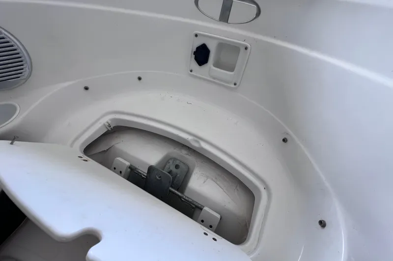 Slide: The Image of Interior view of 2024 Tahoe 200 S boat compartment with storage area. - 31