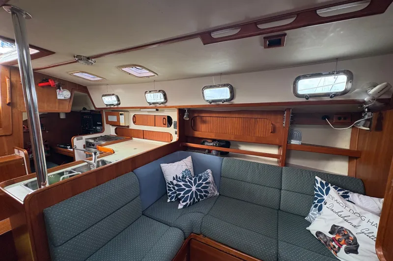 Slide: The Image of Interior of 2002 Caliber 40LRC sailboat with cozy seating and nautical decor. - 32