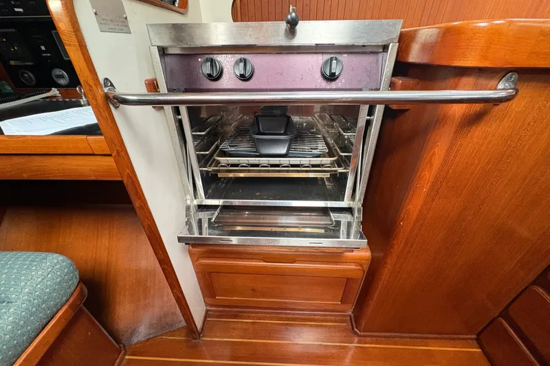 Slide: The Image of Stainless steel oven in 2002 Caliber 40LRC yacht galley with wooden cabinetry. - 27