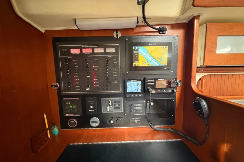 Slide: The Image of Control panel of a 2002 Caliber 40LRC yacht with navigation and communication equipment. - 28