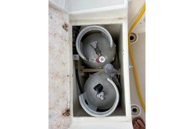 Slide: The Image of Propane tanks in storage compartment of 2002 Caliber 40LRC boat. - 49