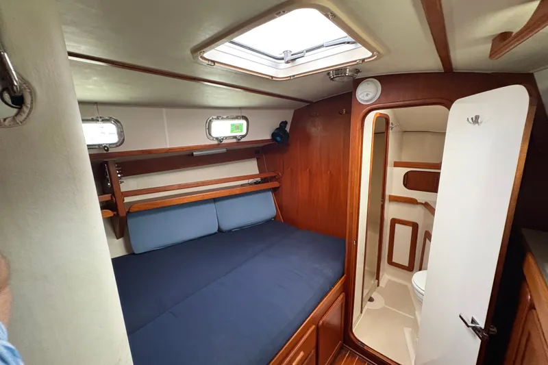 Slide: The Image of Cozy cabin interior of 2002 Caliber 40LRC sailboat with bed and bathroom. - 15