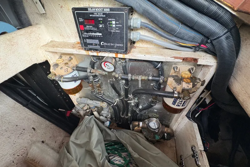 Slide: The Image of Engine compartment of a 2002 Caliber 40LRC with solar boost controller and fuel filters. - 51