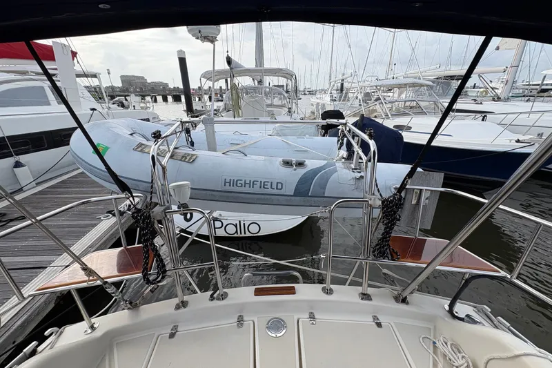 Slide: The Image of Docked 2002 Caliber 40LRC sailboat with inflatable dinghy at marina. - 47