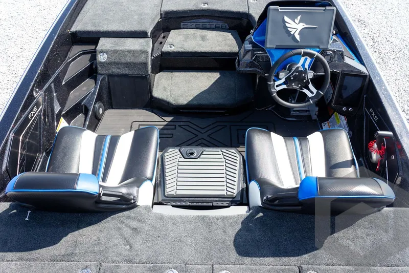 Slide: The Image of 2027 Skeeter FXE20 Pro boat interior with modern steering and seating design. - 18