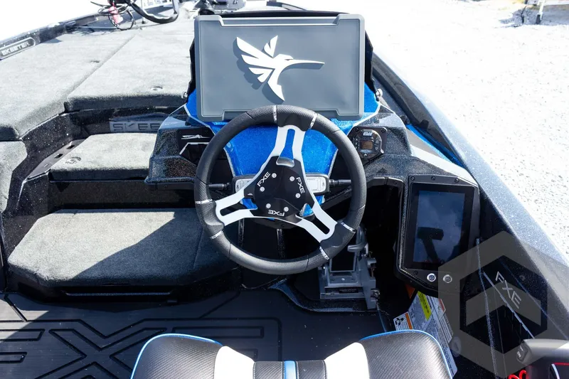 Slide: The Image of Steering console of 2027 Skeeter FXE20 Pro boat with modern controls and displays. - 19